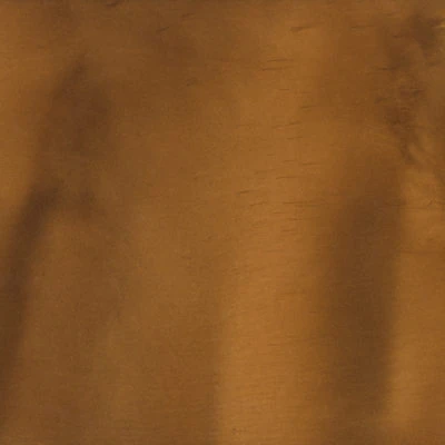 Brown textured fabric background with subtle shadows