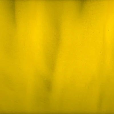 Close-up of textured yellow surface background.