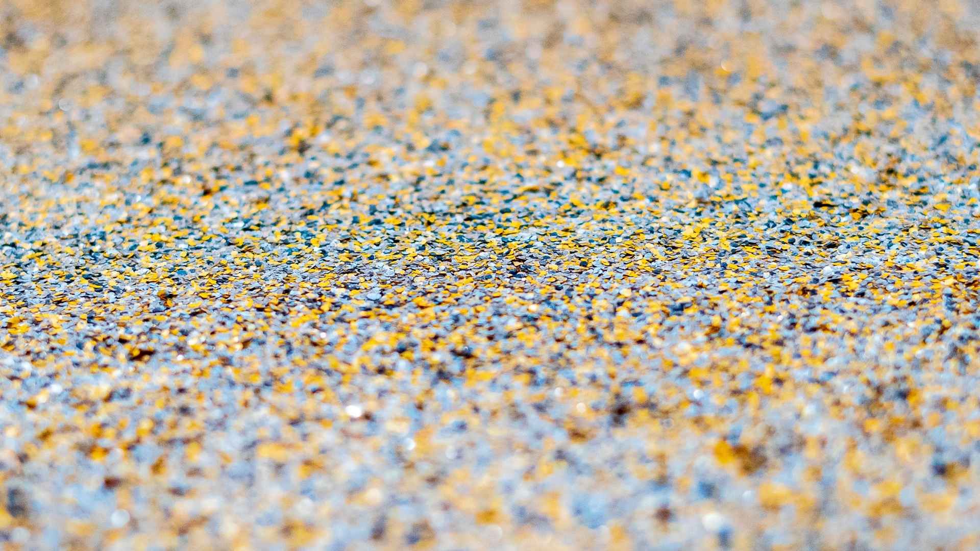 Close-up of colorful pebbles on a concrete surface