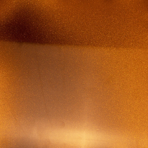 Textured metallic bronze surface.