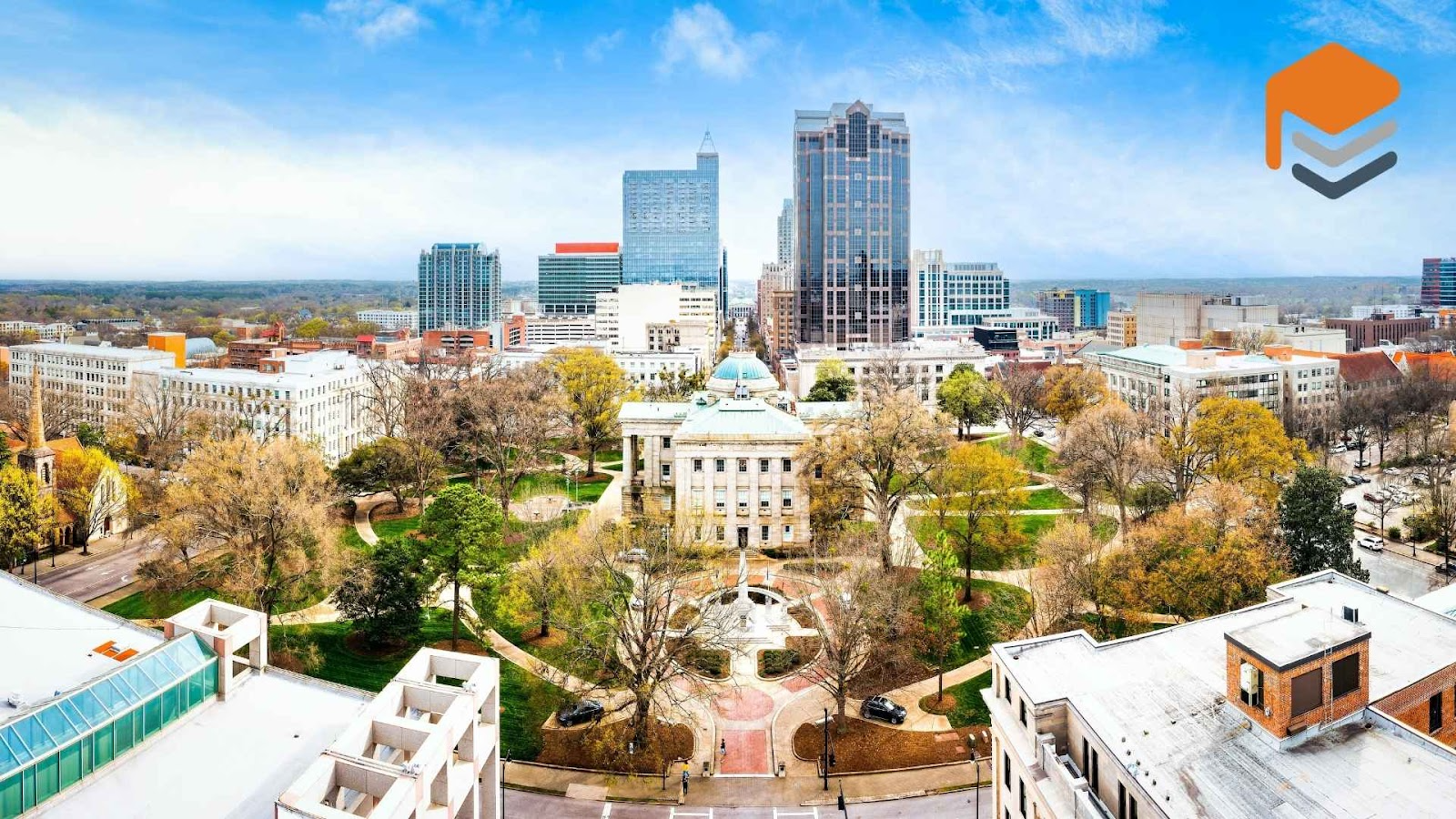 Drone panorama of the North Carolina State Capitol and Raleigh skyline, where commercial and industrial coating services are often needed.