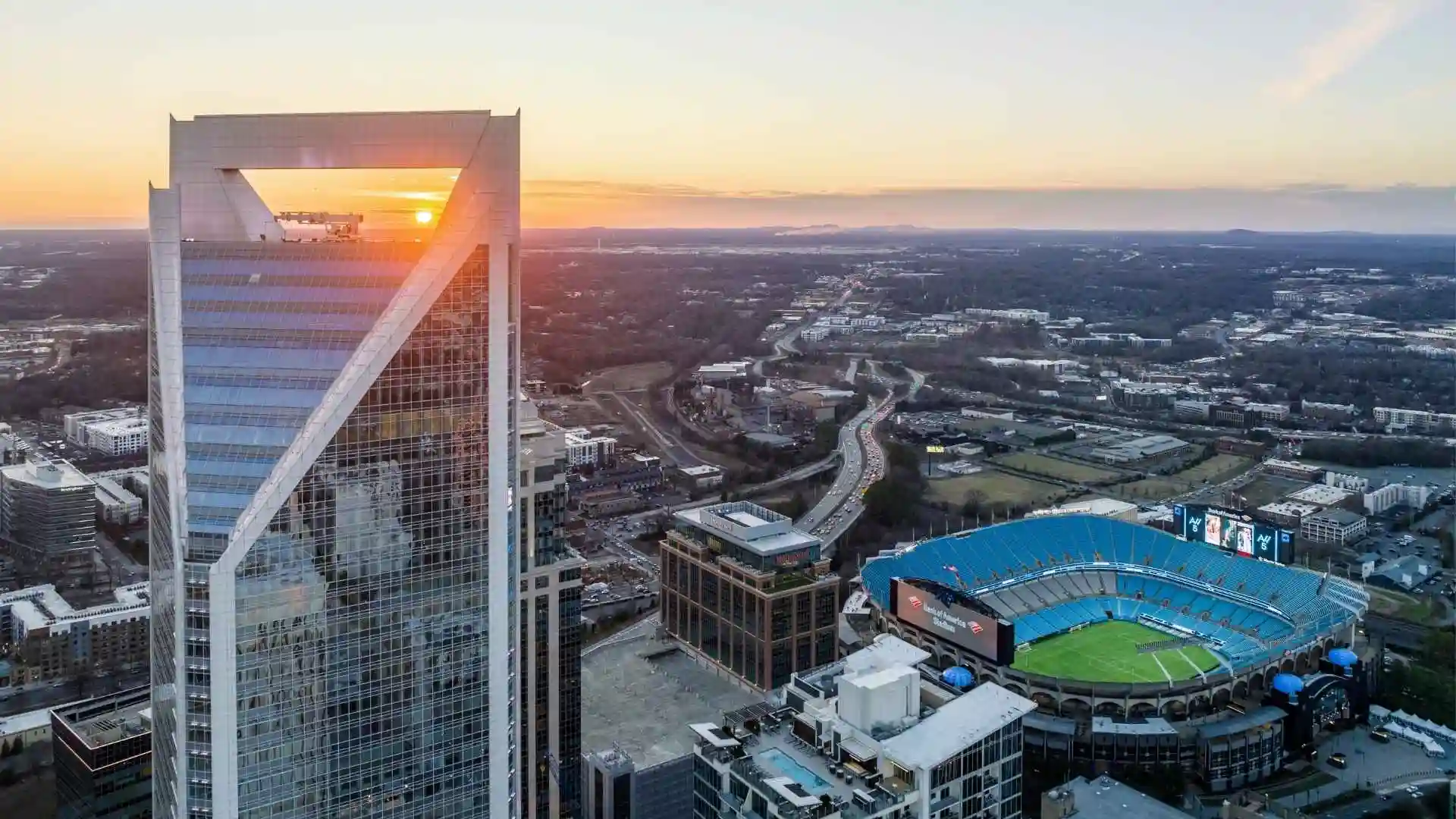 Charlotte skyline at sunset with stadium view