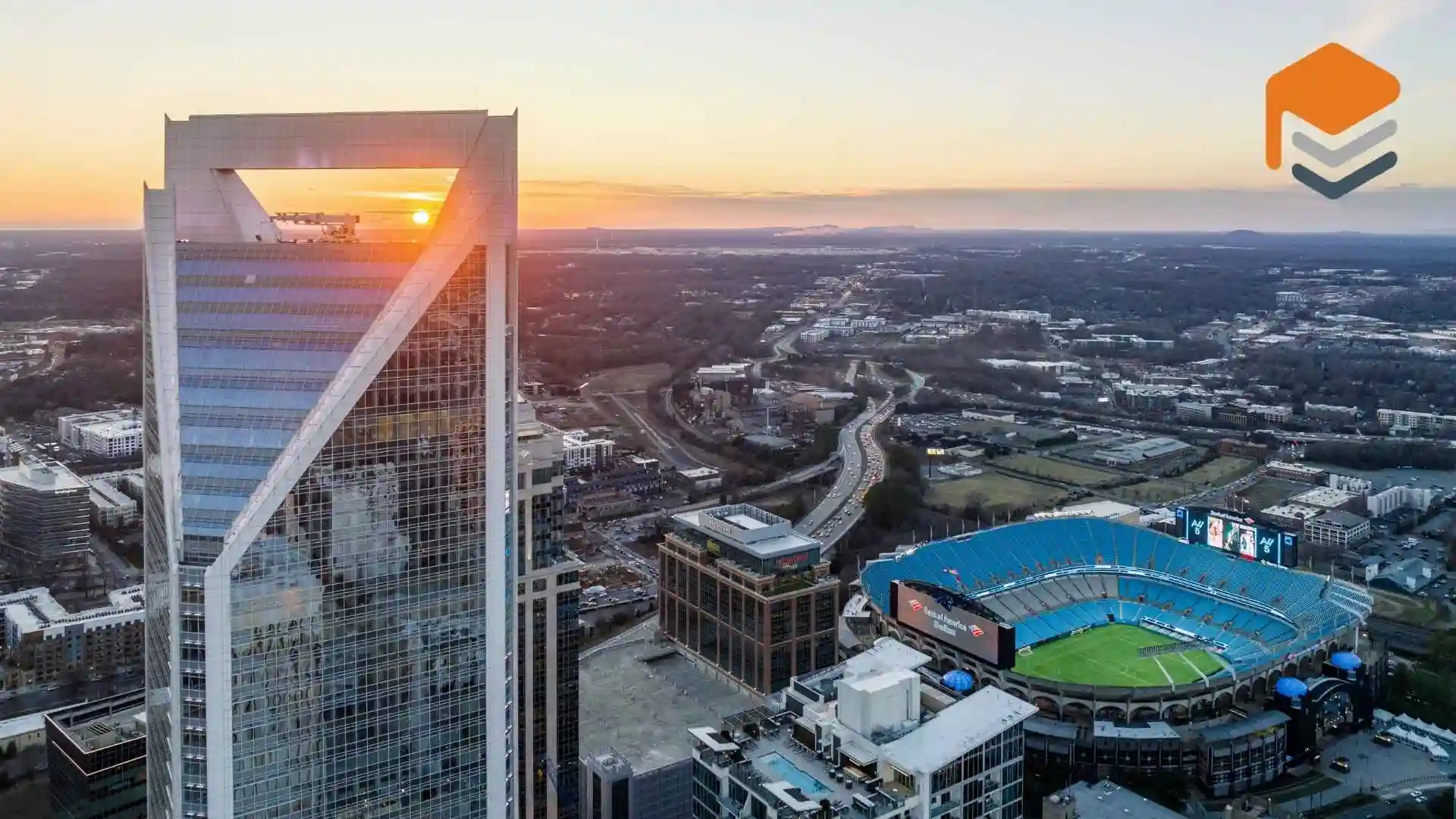 Aerial view of a downtown and stardium in North carolina where driveway and walkway coatings are common.