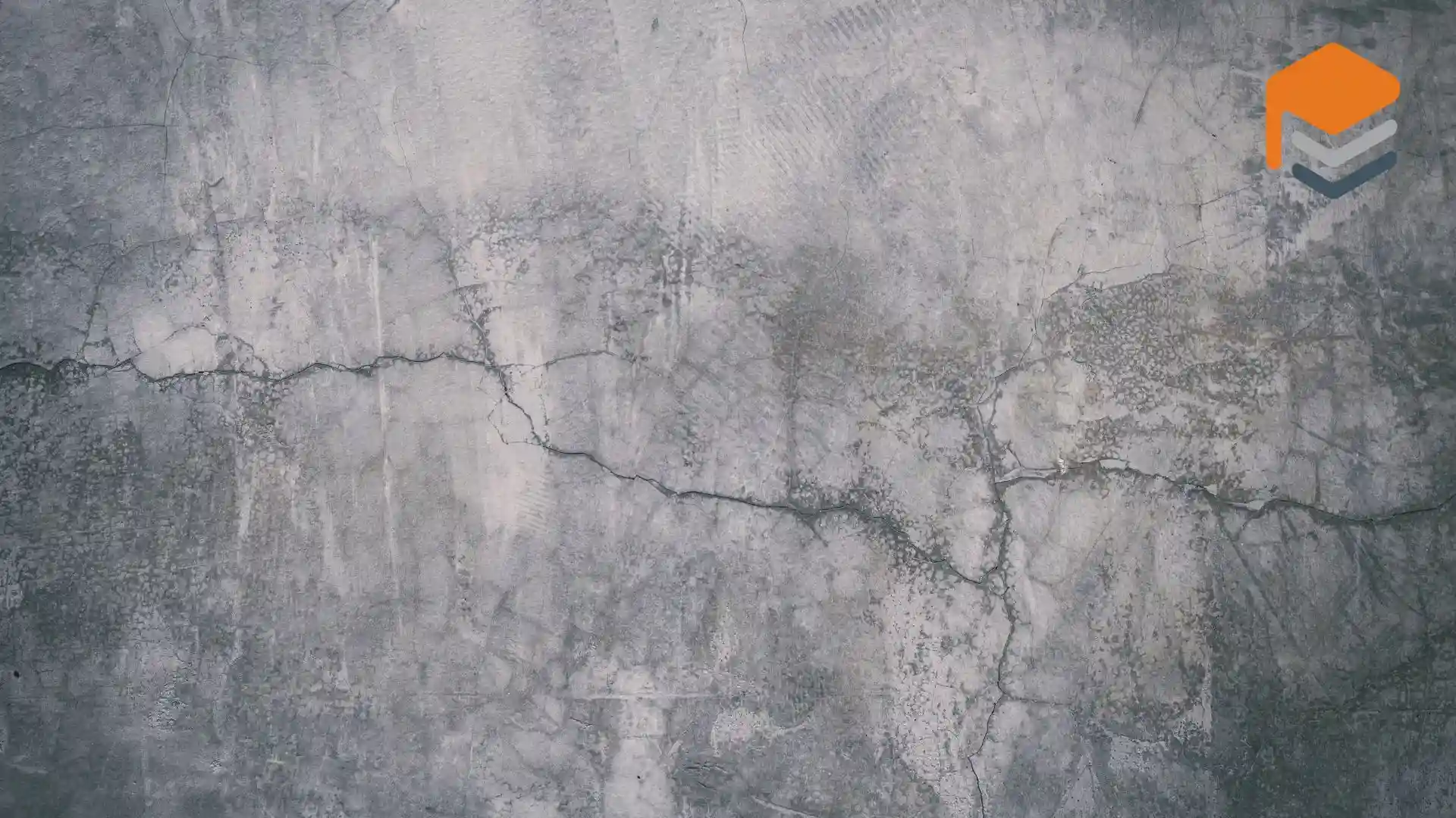 Cracked concrete wall with layers of texture.