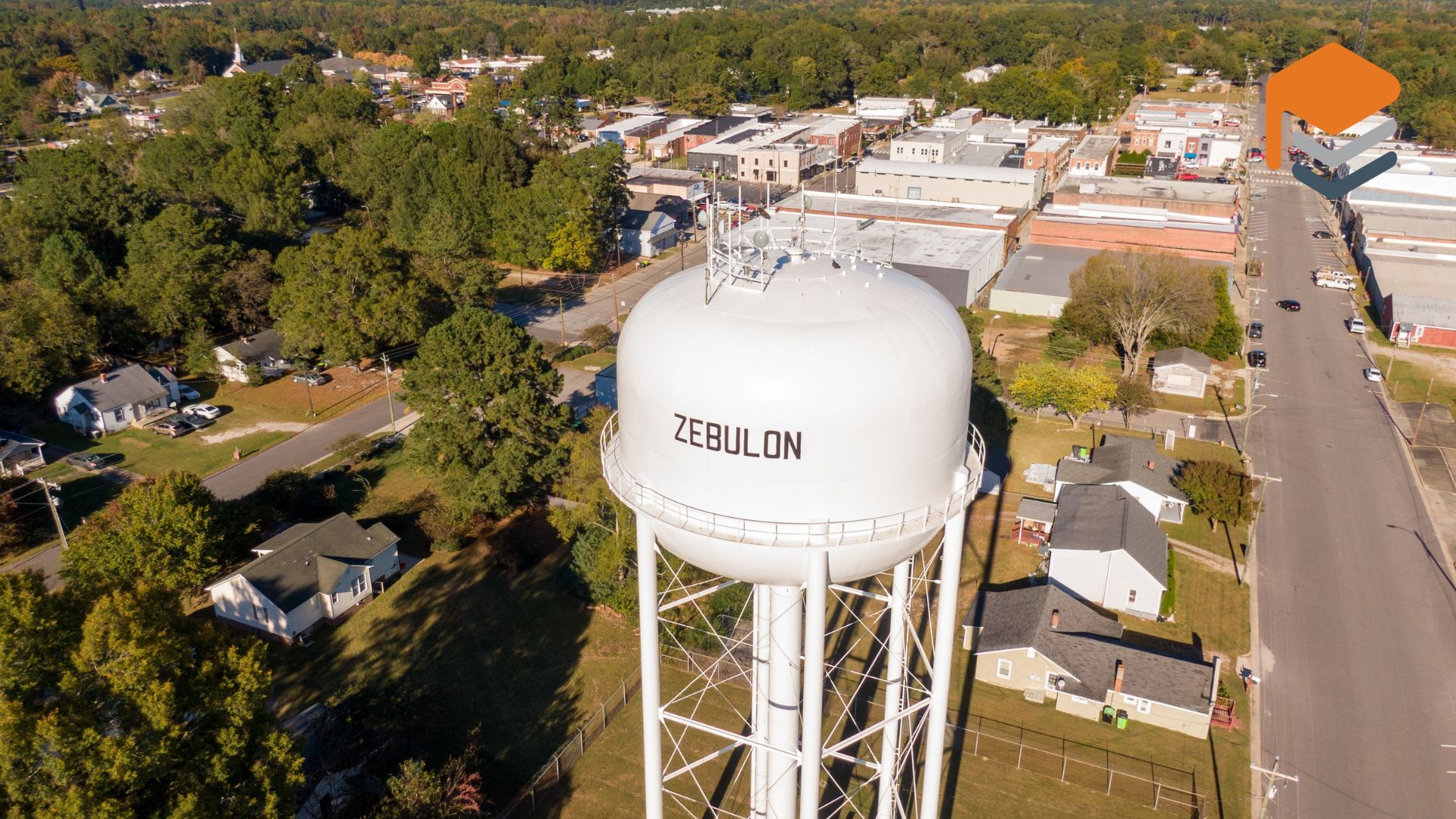 A water tank labeled Zebulon , near a residential area where pool deck concrete coatings are often needed.